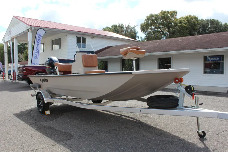 Slide: The Image of 2024 Avid 18 Rogue boat on trailer outside dealership. - 3
