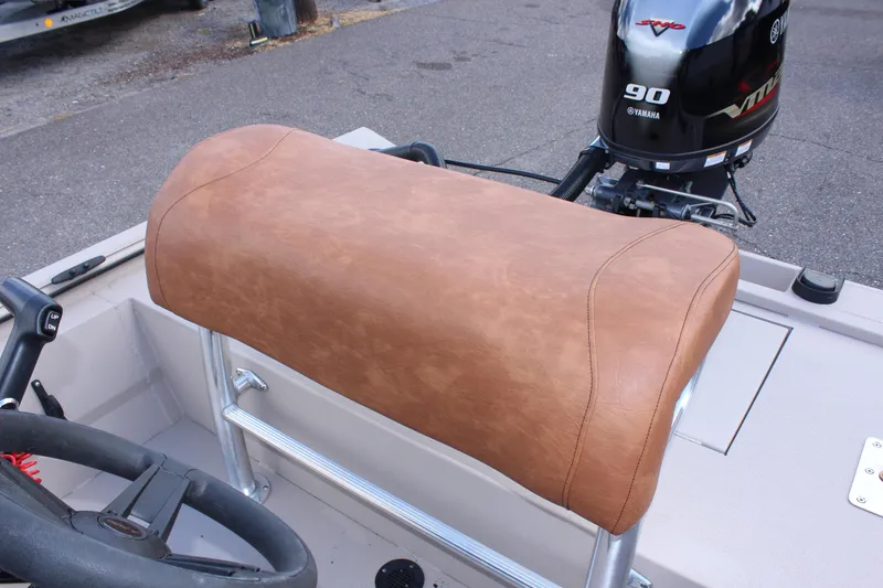 Slide: The Image of Avid 18 Rogue 2024 boat with Yamaha 90 engine and tan leather seat. - 7