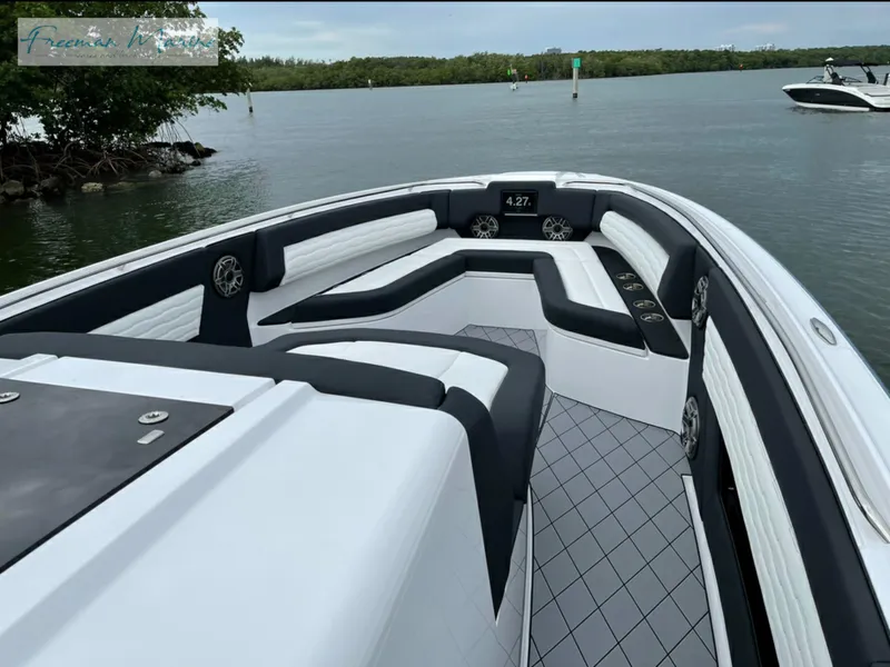 Slide: The Image of 2021 Cigarette 41 Nighthawk boat interior with luxurious seating on calm water. - 10