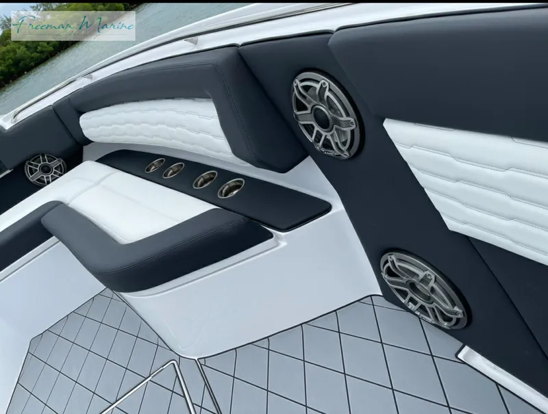 Slide: The Image of 2021 Cigarette 41 Nighthawk boat interior with luxury seating and built-in speakers. - 14