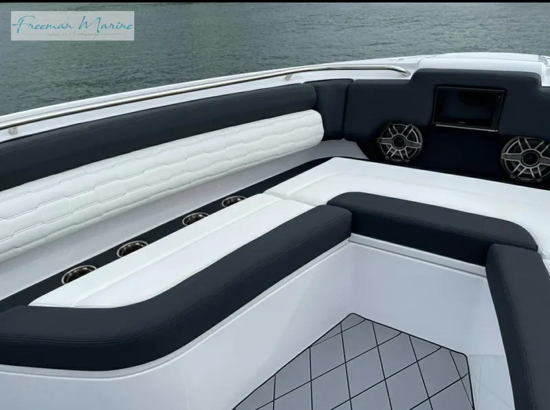 Slide: The Image of 2021 Cigarette 41 Nighthawk boat interior with cushioned seating and speakers. - 15