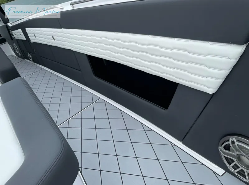 Slide: The Image of 2021 Cigarette 41 Nighthawk interior with diamond-pattern flooring and cushioned seating. - 16