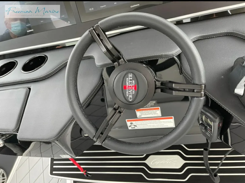 Slide: The Image of 2021 Cigarette 41 Nighthawk steering wheel and dashboard close-up. - 18