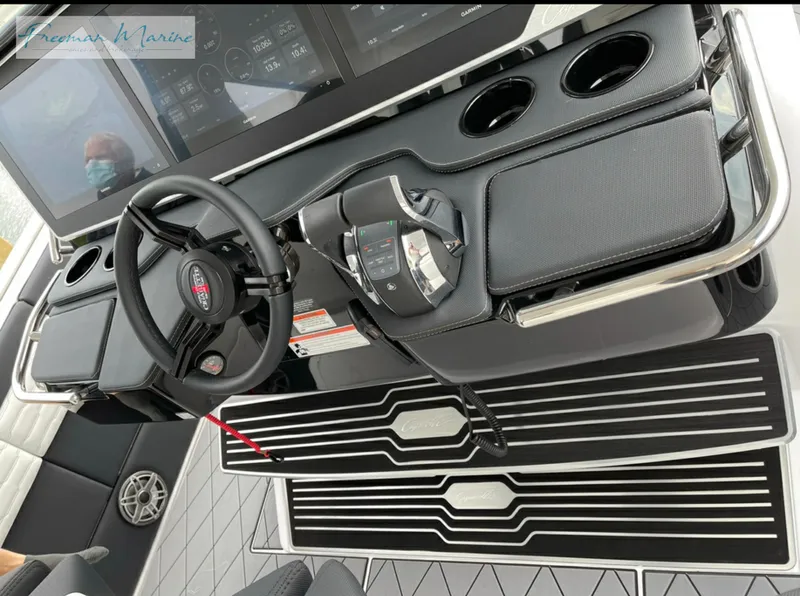 Slide: The Image of 2021 Cigarette 41 Nighthawk boat cockpit with steering wheel and control panel. - 20