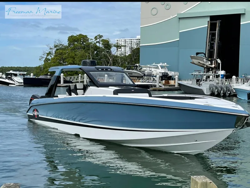 Slide: The Image of 2021 Cigarette 41 Nighthawk boat docked in a marina. - 23