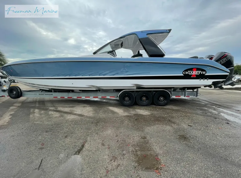 Slide: The Image of 2021 Cigarette 41 Nighthawk boat on a trailer, side view, Freeman Marine. - 4