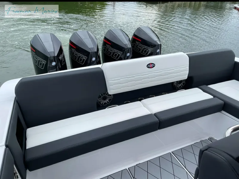 Slide: The Image of 2021 Cigarette 41 Nighthawk boat with quad outboard engines and cushioned seating. - 8