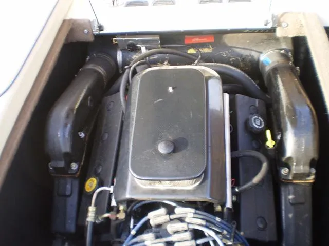 Slide: The Image of 2001 Malibu VLX engine compartment with visible components and wiring. - 11