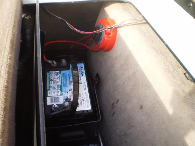 Slide: The Image of Battery compartment of a 2001 Malibu VLX boat. - 12