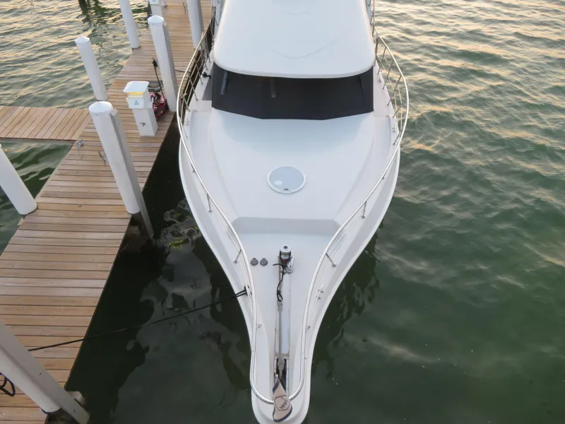 Slide: The Image of Top view of a 2000 Bluewater Yachts 5800 Motor Yacht docked. - 10