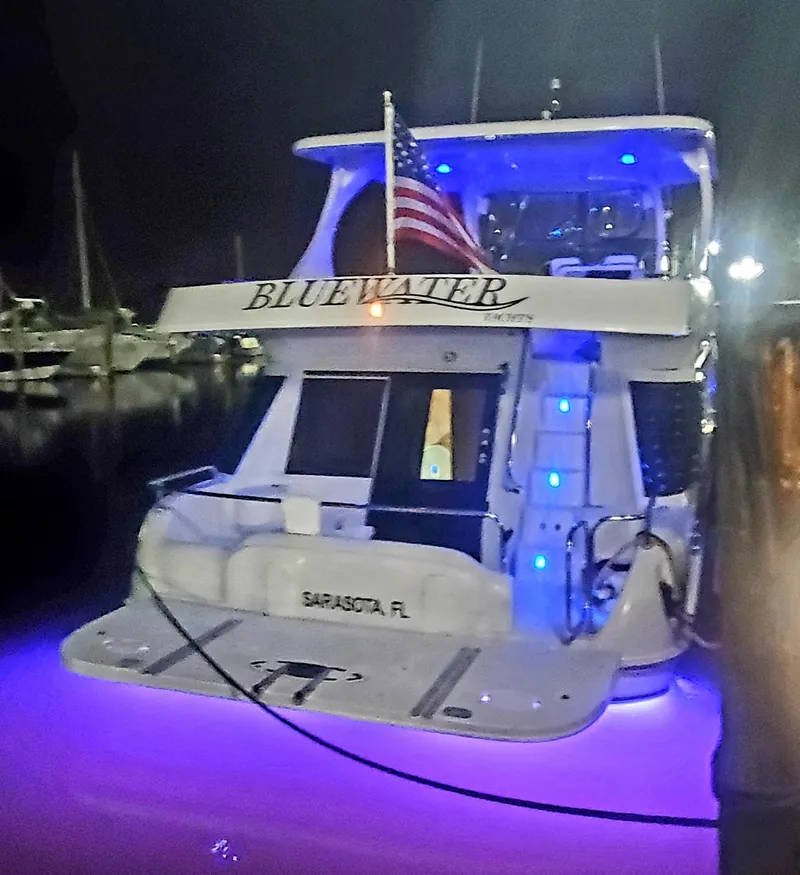 Slide: The Image of Illuminated Bluewater Yachts 5800 Motor Yacht with Christmas decorations. - 17