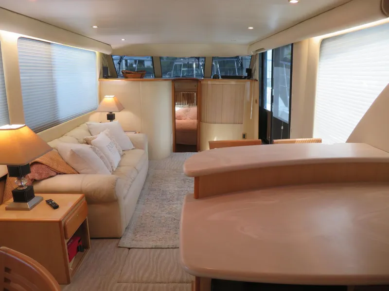 Slide: The Image of Interior of 2000 Bluewater Yachts 5800 Motor Yacht, featuring cozy living area and modern design. - 26