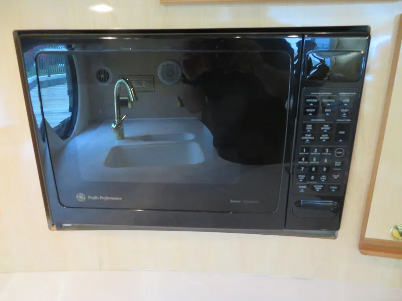 Slide: The Image of Built-in microwave in the kitchen of a 2000 Bluewater Yachts 5800 Motor Yacht. - 33