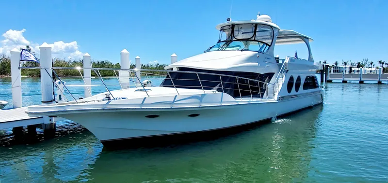 Slide: The Image of 2000 Bluewater Yachts 5800 Motor Yacht docked in sunny marina. - 4