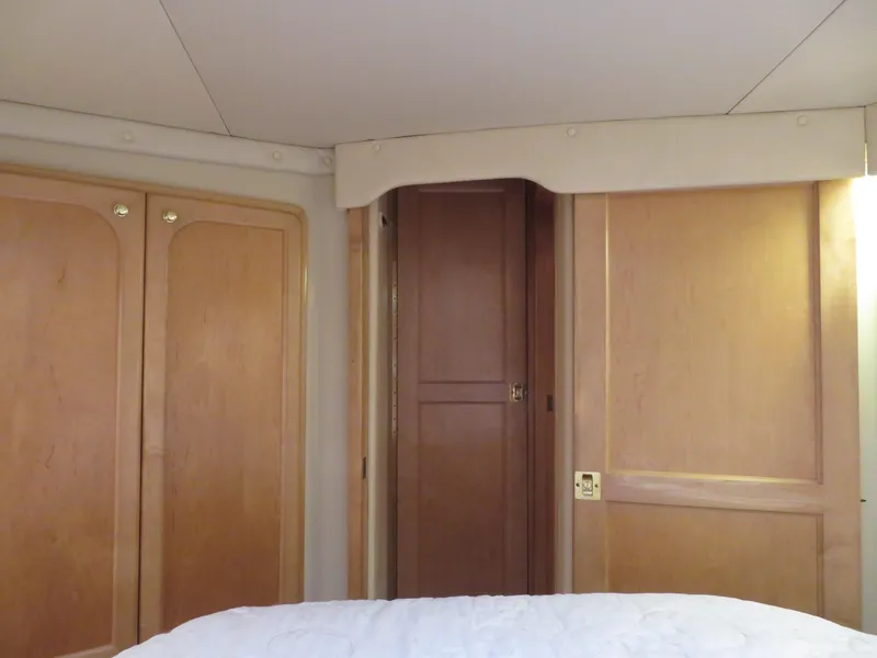 Slide: The Image of Interior cabin of 2000 Bluewater Yachts 5800 Motor Yacht with wooden doors and cabinets. - 43