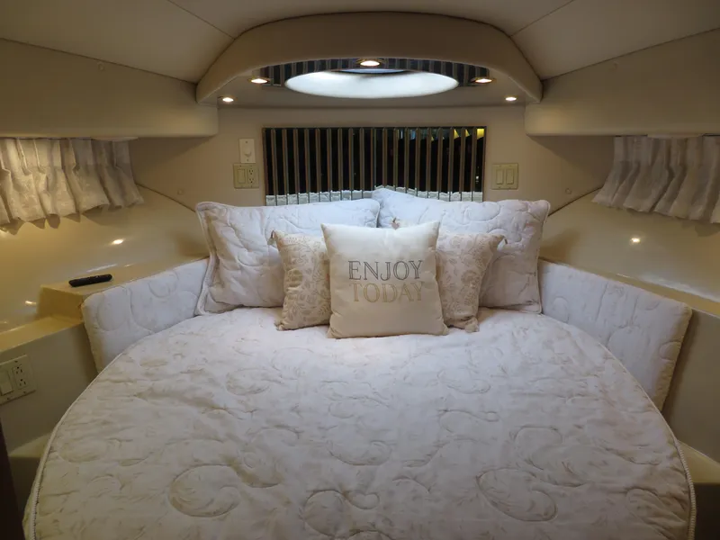 Slide: The Image of Luxurious bedroom in 2000 Bluewater Yachts 5800 Motor Yacht with cozy bedding. - 46