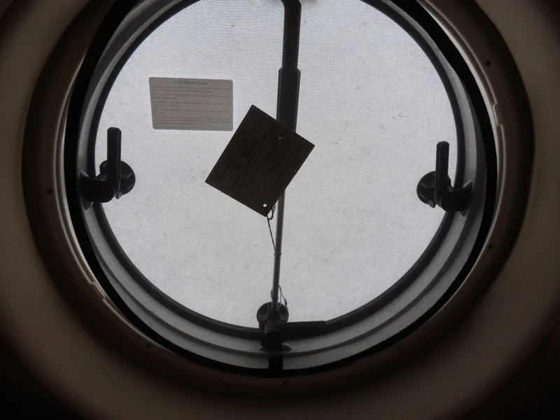 Slide: The Image of Round porthole window on 2000 Bluewater Yachts 5800 Motor Yacht. - 47