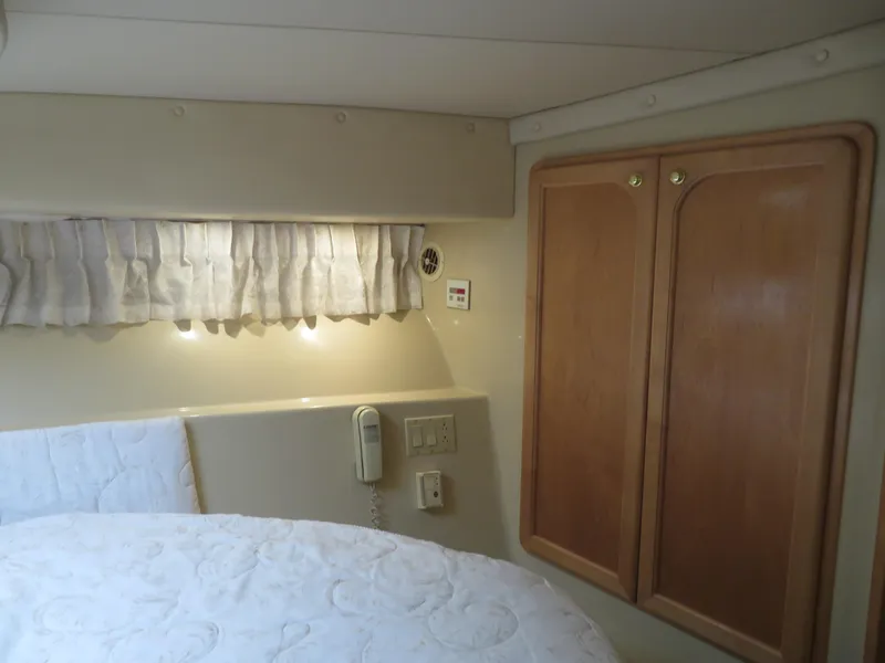Slide: The Image of Interior cabin of 2000 Bluewater Yachts 5800 Motor Yacht with wood cabinets and bed. - 50