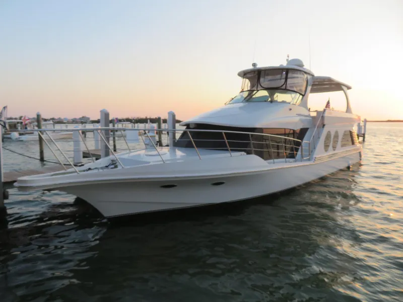 Slide: The Image of 2000 Bluewater Yachts 5800 Motor Yacht docked at sunset. - 8