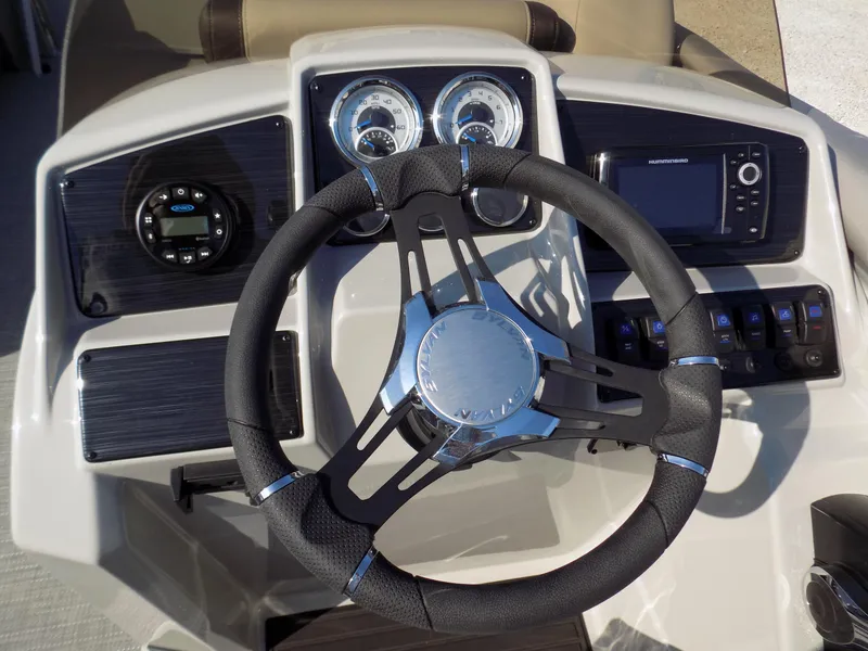 Slide: The Image of 2024 Sylvan Mirage 8522 LZ dashboard with steering wheel and control panel. - 10