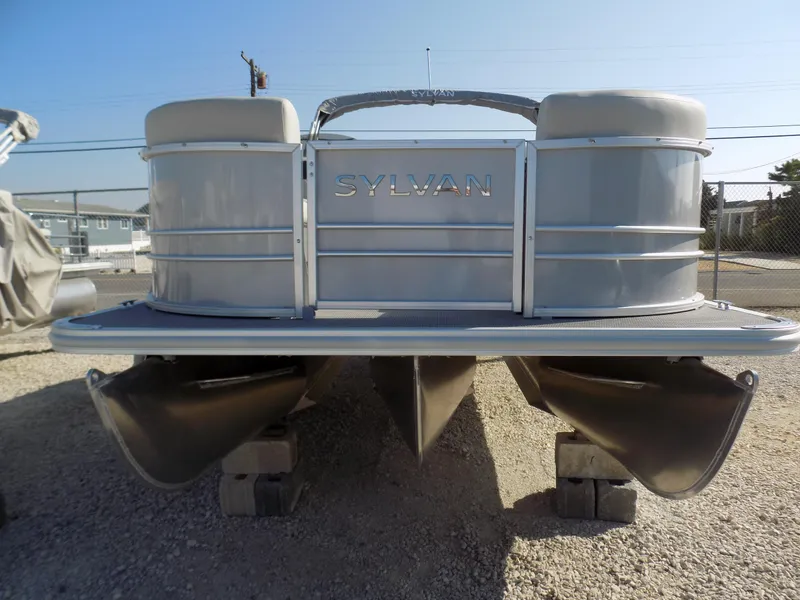 Slide: The Image of 2024 Sylvan Mirage 8522 LZ pontoon boat on display, front view. - 3