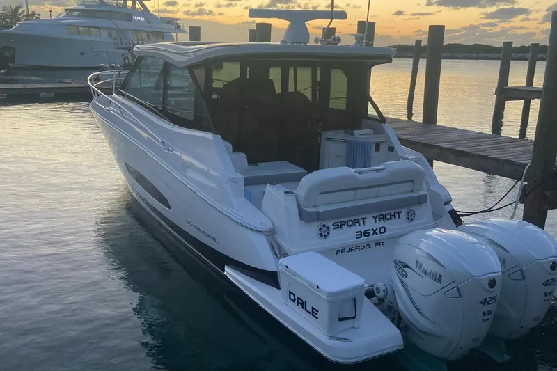 Slide: The Image of 2023 Regal 36 XO Sport Yacht docked at sunset. - 9