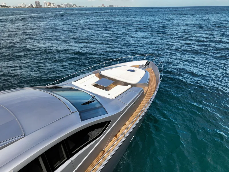 Slide: The Image of 2017 Pershing 82 VHP yacht cruising on open water. - 19