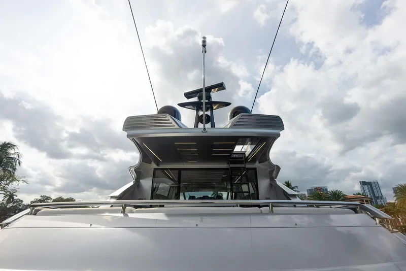 Slide: The Image of 2017 Pershing 82 VHP yacht rear view under cloudy sky. - 35