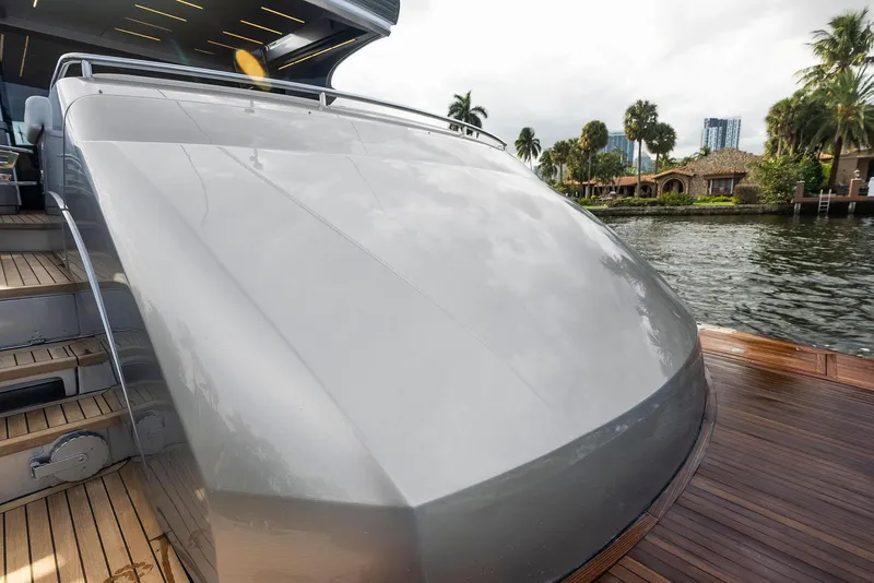 Slide: The Image of 2017 Pershing 82 VHP yacht stern view with sleek design and waterfront background. - 37