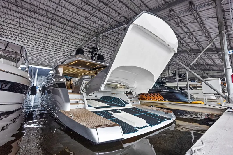 Slide: The Image of 2017 Pershing 82 VHP yacht with open garage in marina. - 40