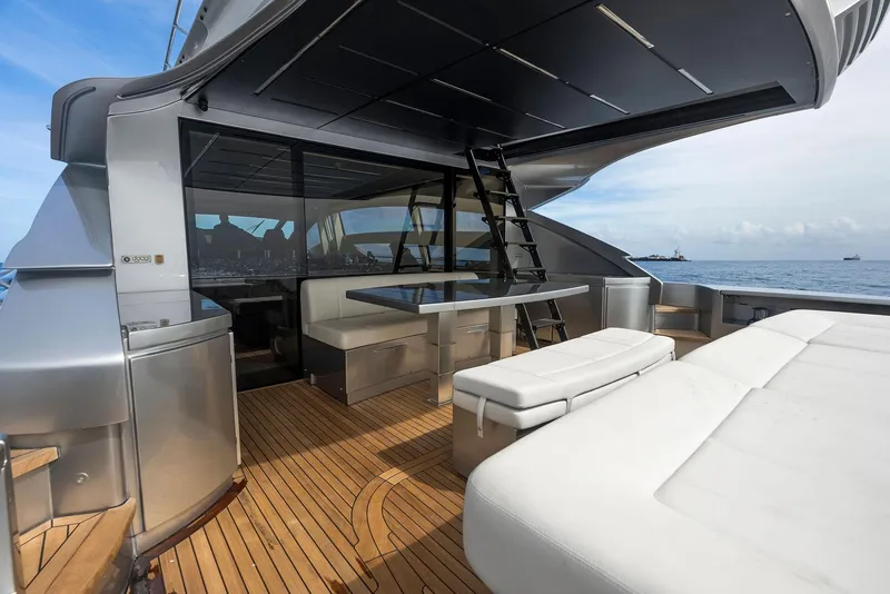 Slide: The Image of Luxury deck of 2017 Pershing 82 VHP yacht with modern seating and ocean view. - 42