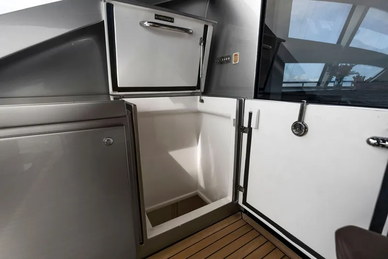 Slide: The Image of 2017 Pershing 82 VHP yacht interior storage compartments and refrigerator. - 46