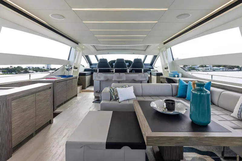 Slide: The Image of Luxurious interior of 2017 Pershing 82 VHP yacht with modern furnishings and panoramic windows. - 47