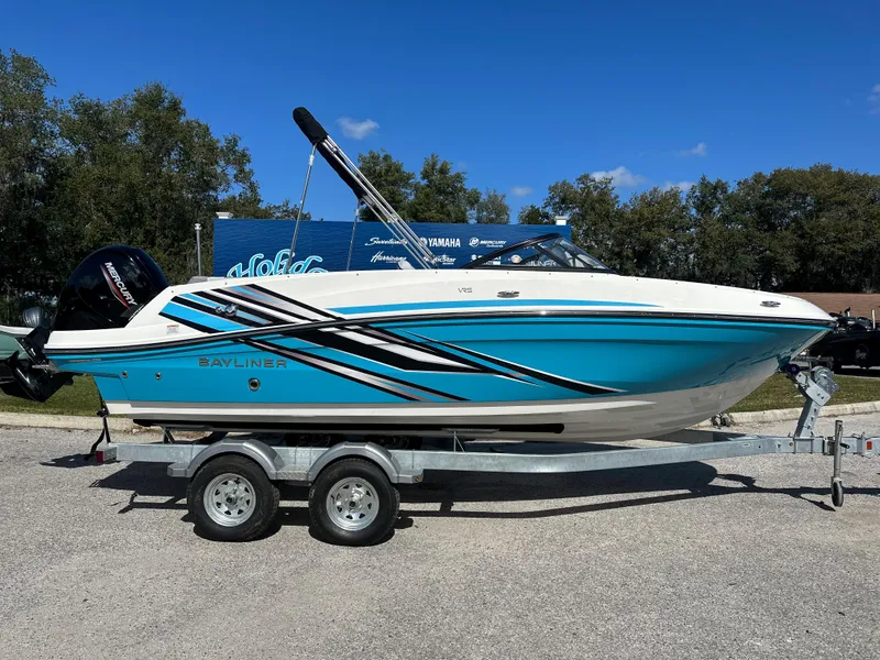 The Image of 2024 Bayliner VR5 Bowrider OB on trailer, blue and white exterior. - 0