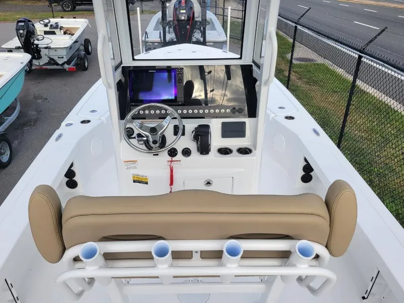 Slide: The Image of 2024 Blazer 2550 GTS boat interior with steering console and seating. - 10