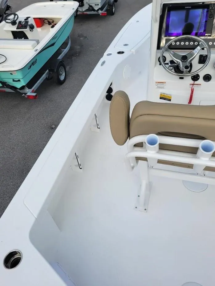 Slide: The Image of 2024 Blazer 2550 GTS boat interior with steering console and seating. - 11