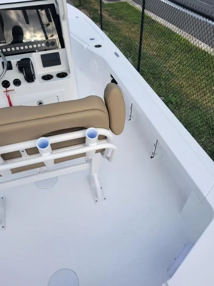 Slide: The Image of 2024 Blazer 2550 GTS boat interior with beige seating and white deck. - 12