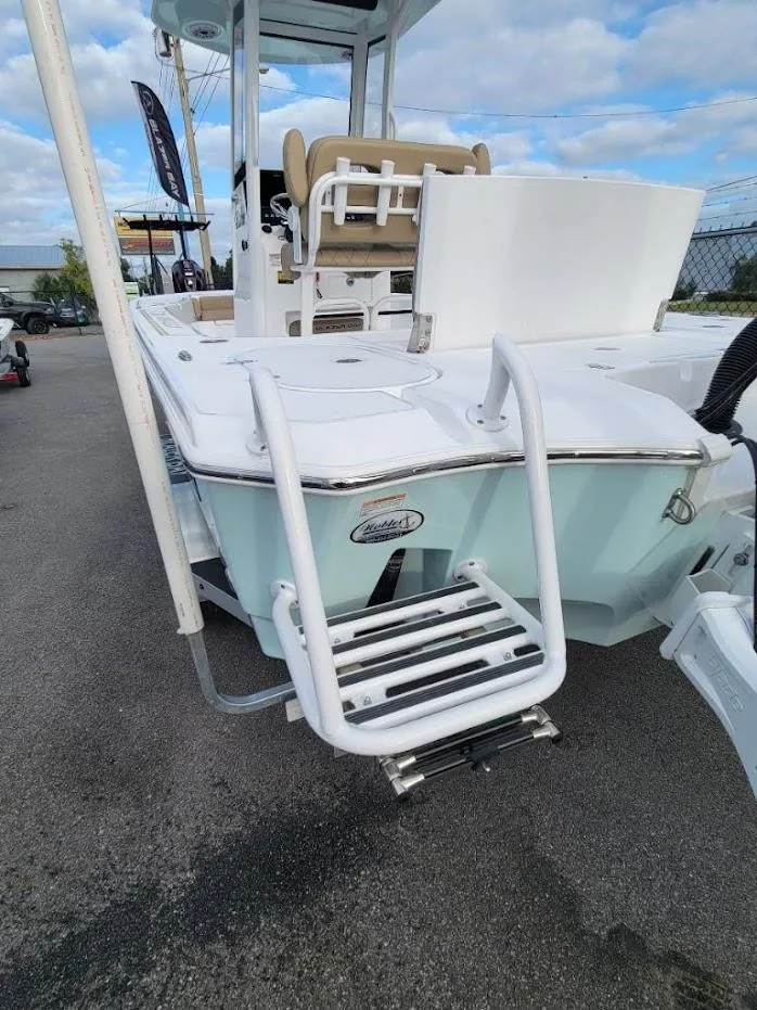 Slide: The Image of 2024 Blazer 2550 GTS boat with swim ladder and seating area. - 13