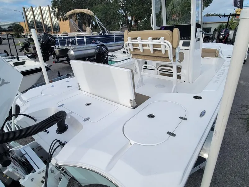 Slide: The Image of 2024 Blazer 2550 GTS boat, white deck, center console, and seating area. - 15