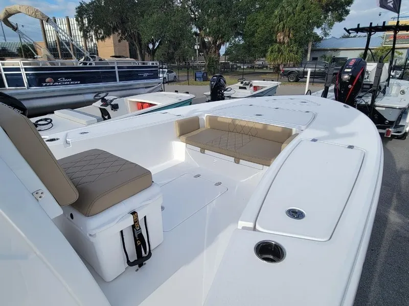 Slide: The Image of 2024 Blazer 2550 GTS boat with cushioned seating and storage compartments. - 17