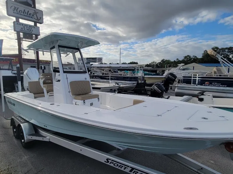 Slide: The Image of 2024 Blazer 2550 GTS boat on a Sport Trail trailer at a dealership. - 19