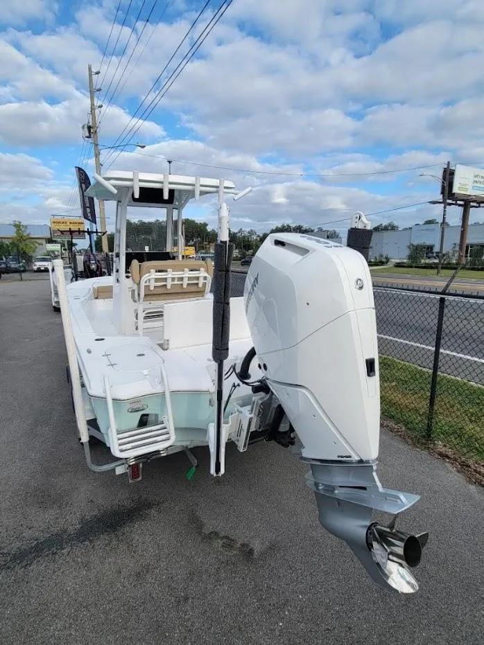 Slide: The Image of 2024 Blazer 2550 GTS boat with outboard motor on a trailer. - 3