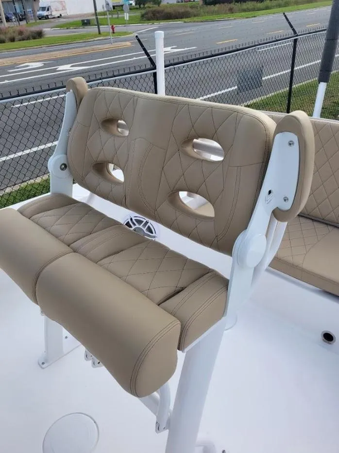 Slide: The Image of 2024 Blazer 2550 GTS boat with tan cushioned seating and white frame. - 9