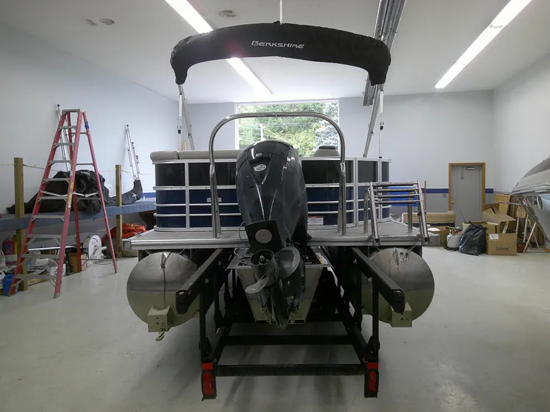 Slide: The Image of 2024 Berkshire 24CL LE 2.75 pontoon boat in a storage facility. - 4