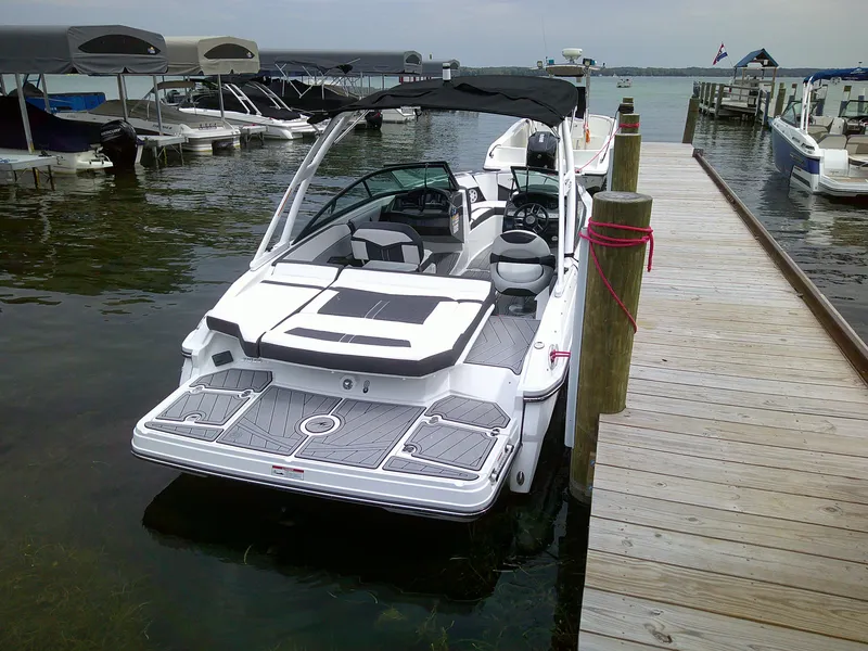 Slide: The Image of 2023 Monterey 218 SS Bowrider docked at a marina. - 5
