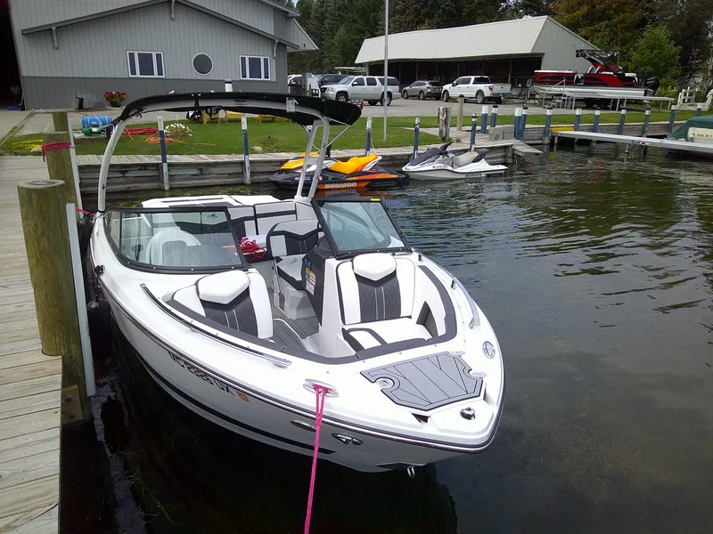 Slide: The Image of 2023 Monterey 218 SS Bowrider docked at a marina. - 7
