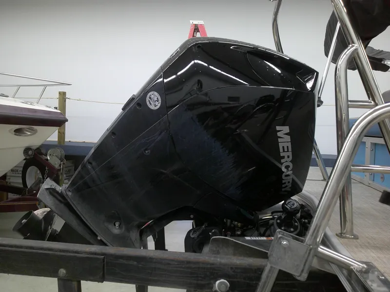 Slide: The Image of 2022 Berkshire 22CL2 CTS boat with Mercury outboard motor in a showroom. - 13
