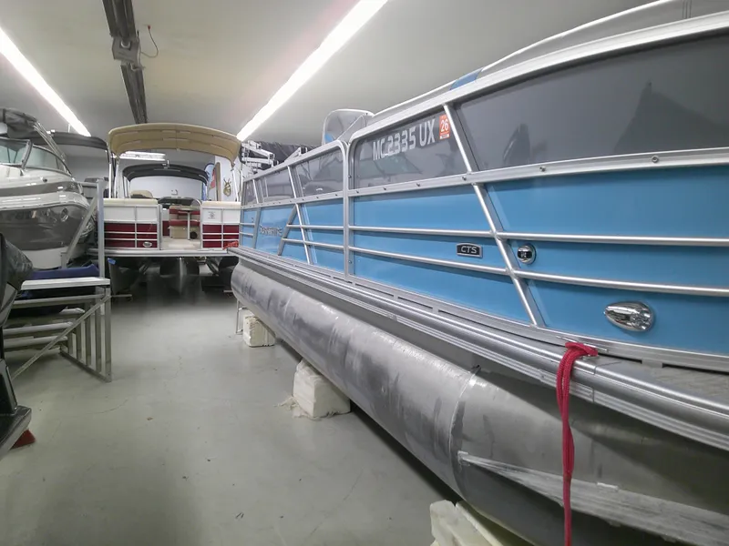 Slide: The Image of 2022 Berkshire 22CL2 CTS pontoon boat in storage facility. - 2