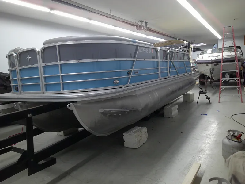 Slide: The Image of 2022 Berkshire 22CL2 CTS pontoon boat in a workshop. - 3