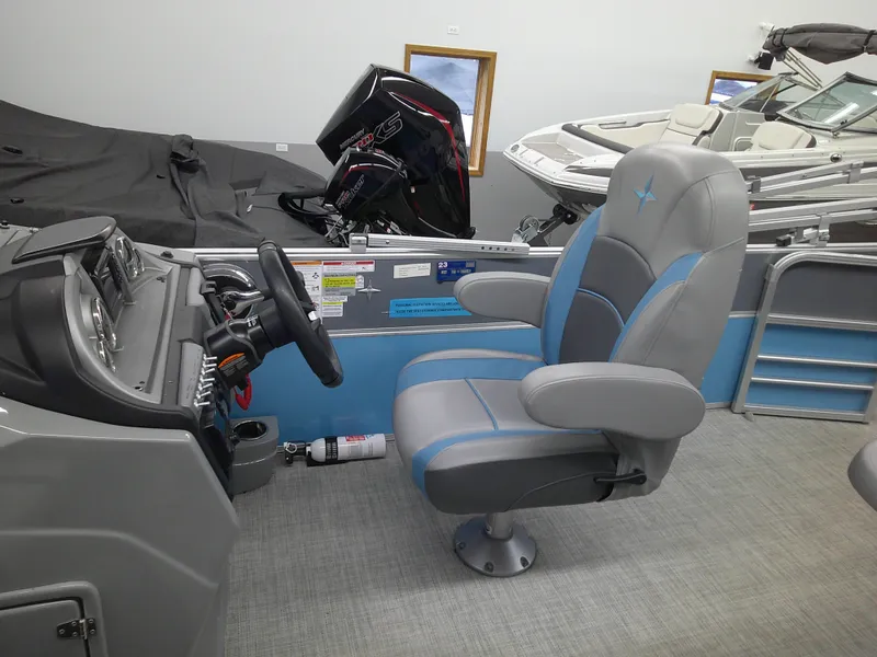 Slide: The Image of 2022 Berkshire 22CL2 CTS boat interior with captain's chair and control panel. - 4
